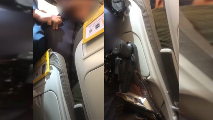 This is a screengrab of videos showing an Egyptian passenger being arrested on a Vueling flight after it made an emergency landing on November 7 in Rome. 